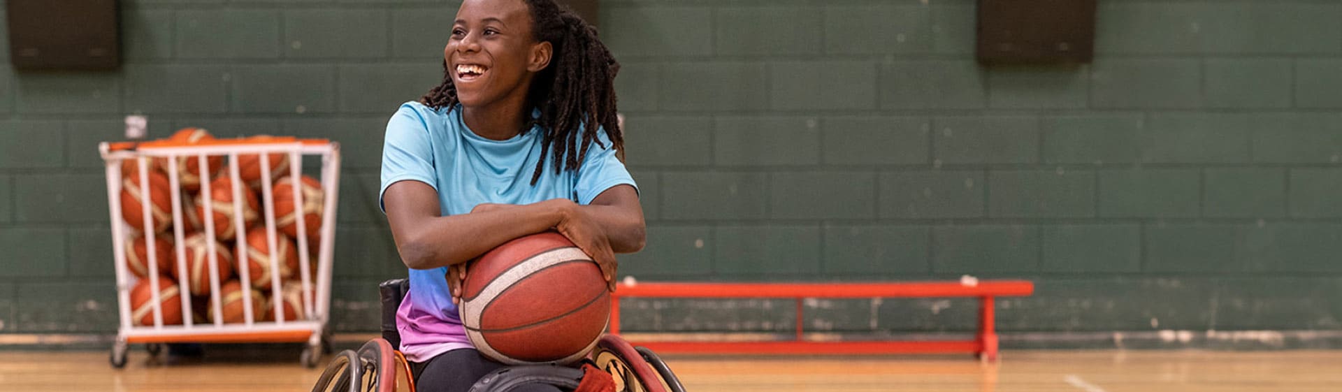 Child in wheelchair on the basketball court