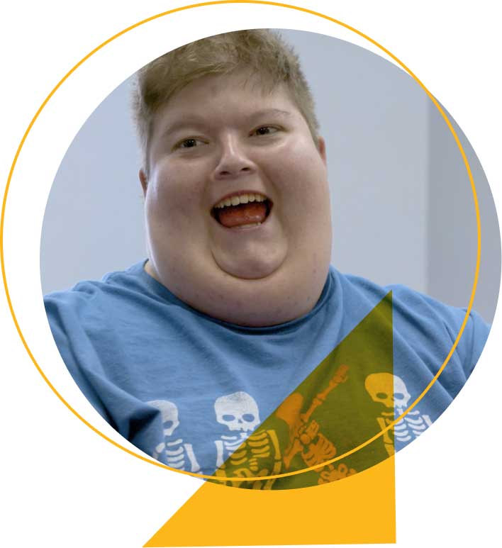 Child with PWS smiling during therapy at The Woodlands children's hospital