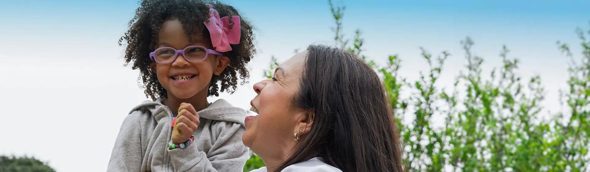 Mom smiling with pediatric care patient